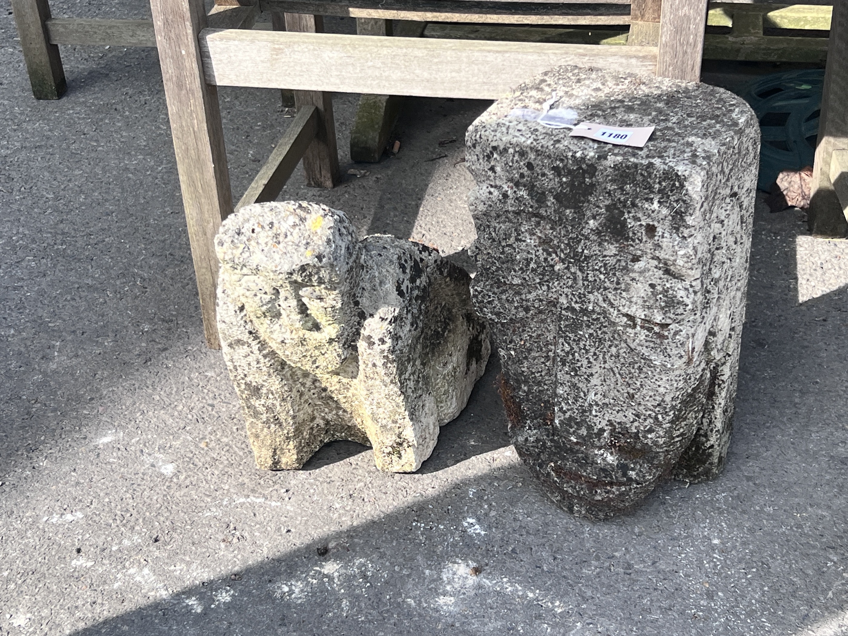 An 'Inca' carved stone head and another of a crouching figure, tallest 43cm